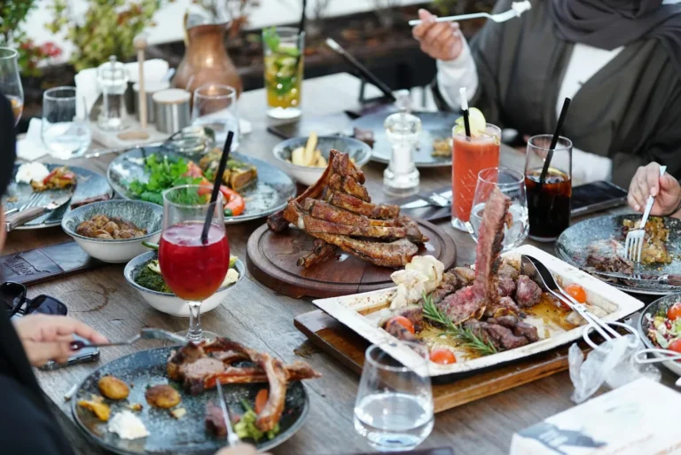 What to order from a local restaurant menu this weekend - A plate of popular restaurant dishes including a burger, fries, and salad on a woo