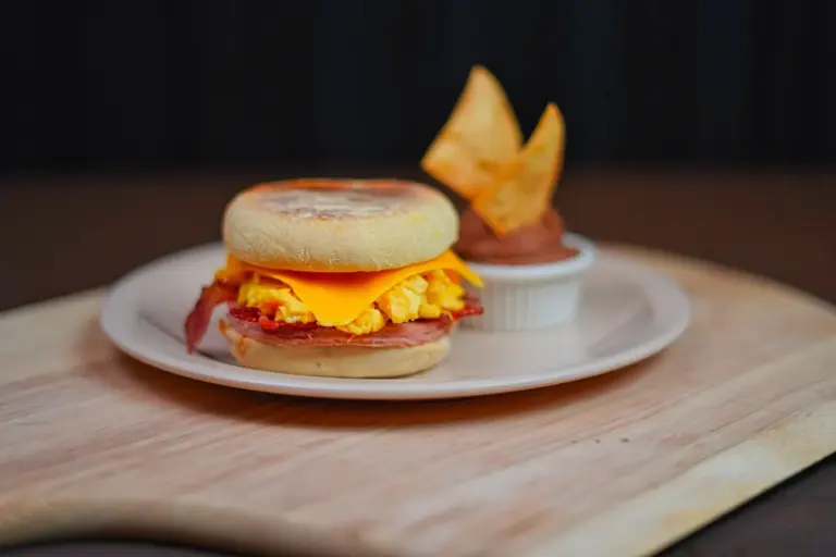 Best breakfast sandwiches at restaurants in America - A classic bacon, egg, and cheese breakfast sandwich on a toasted roll with melted chee