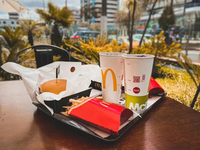 McDonald's Menu Guide With Prices and Best Value Picks - Assortment of McDonald's menu items including McChicken, fries, and a drink on a tr