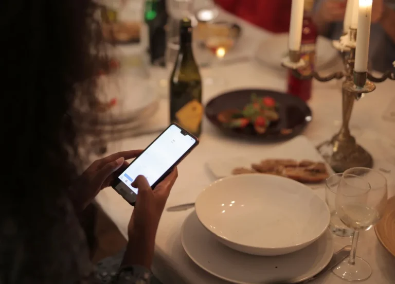 Restaurant Menu Trends to Watch: Value Meals, Digital Menus, and New Flavors - Diner scanning a QR code menu with a smartphone at a restaura