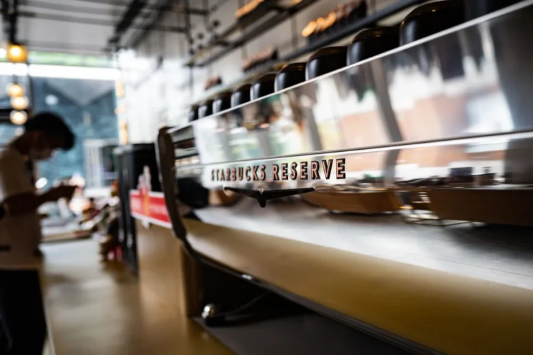 Starbucks Reserve Chicago Restaurant Menu Guide in America - Interior of Starbucks Reserve Chicago Roastery showing coffee bar and menu boar