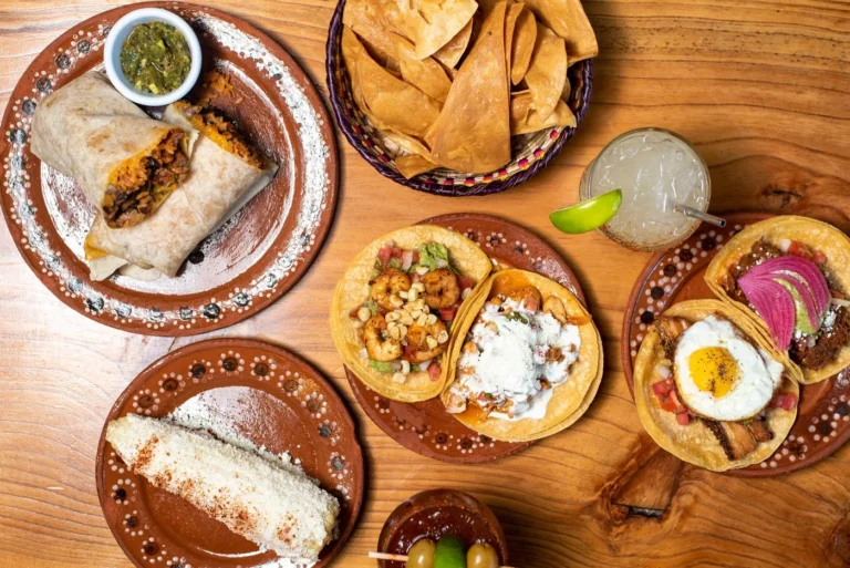 What to Order at a Mexican Restaurant: Tacos, Bowls, Sides, and Drinks - A colorful spread of Mexican tacos, a burrito bowl, chips and salsa